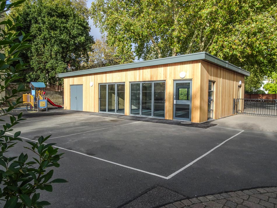 modular school with timber exterior cladding and a plastisol steel fascia
